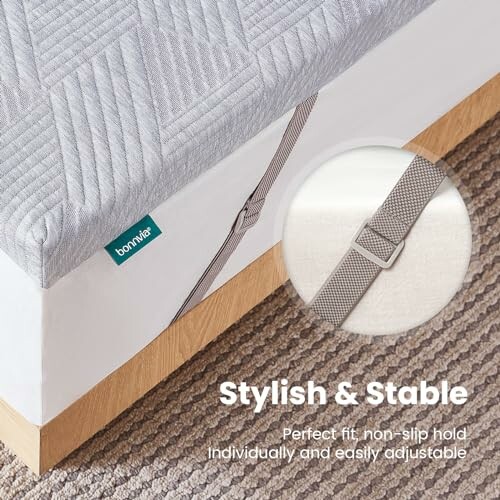 Mattress protector with adjustable strap and non-slip hold.