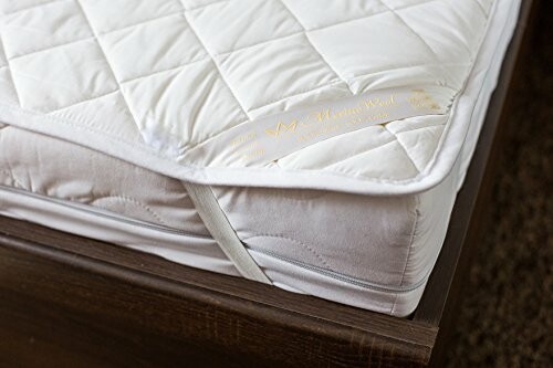 Quilted mattress topper on a bed