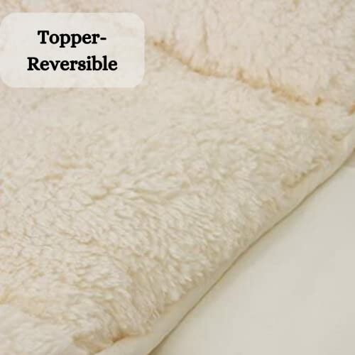 Reversible mattress topper in beige color.